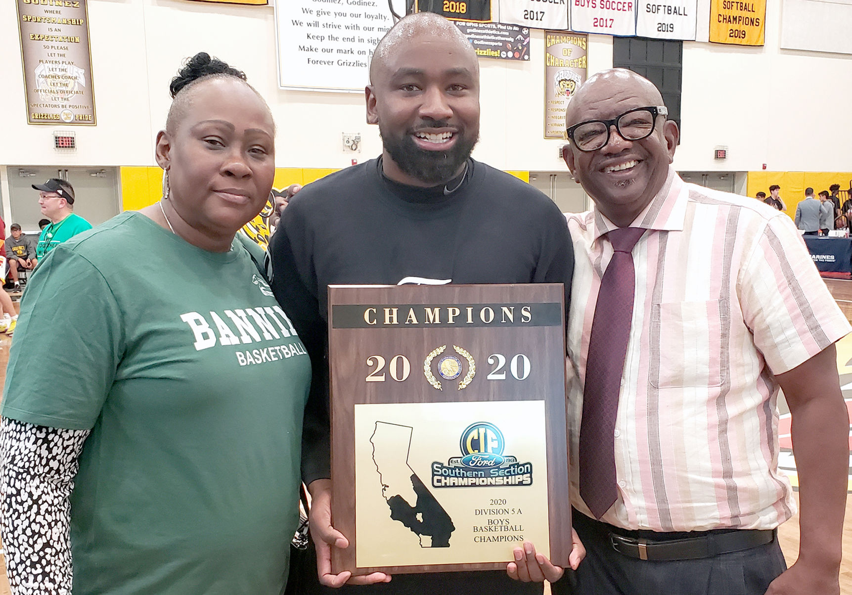 Banning head coach Cory Cornelius celebrates his CIF victory with his mother and father.